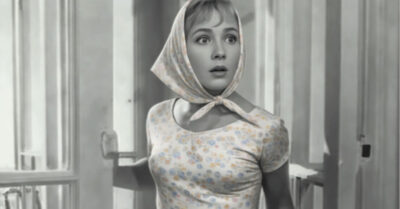 Она спасалась от одиночества, подглядывая за чужими окнами. Пока не увидела его — человека, который жил в голых стенах и жевал сухую лапшу. Её простое, шумное участие перевернуло жизнь обоих, столкнув с призраками прошлого